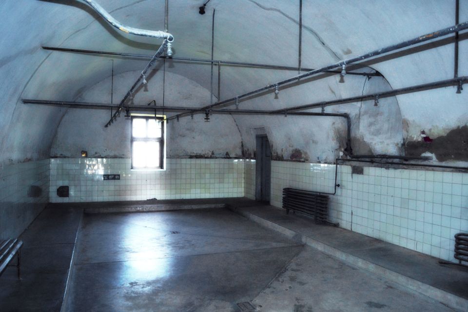 From Prague: All-inclusive Bus Tour to Terezin Memorial - The Camp Grounds Tour in Terezin: Walking Through the WWII Reality